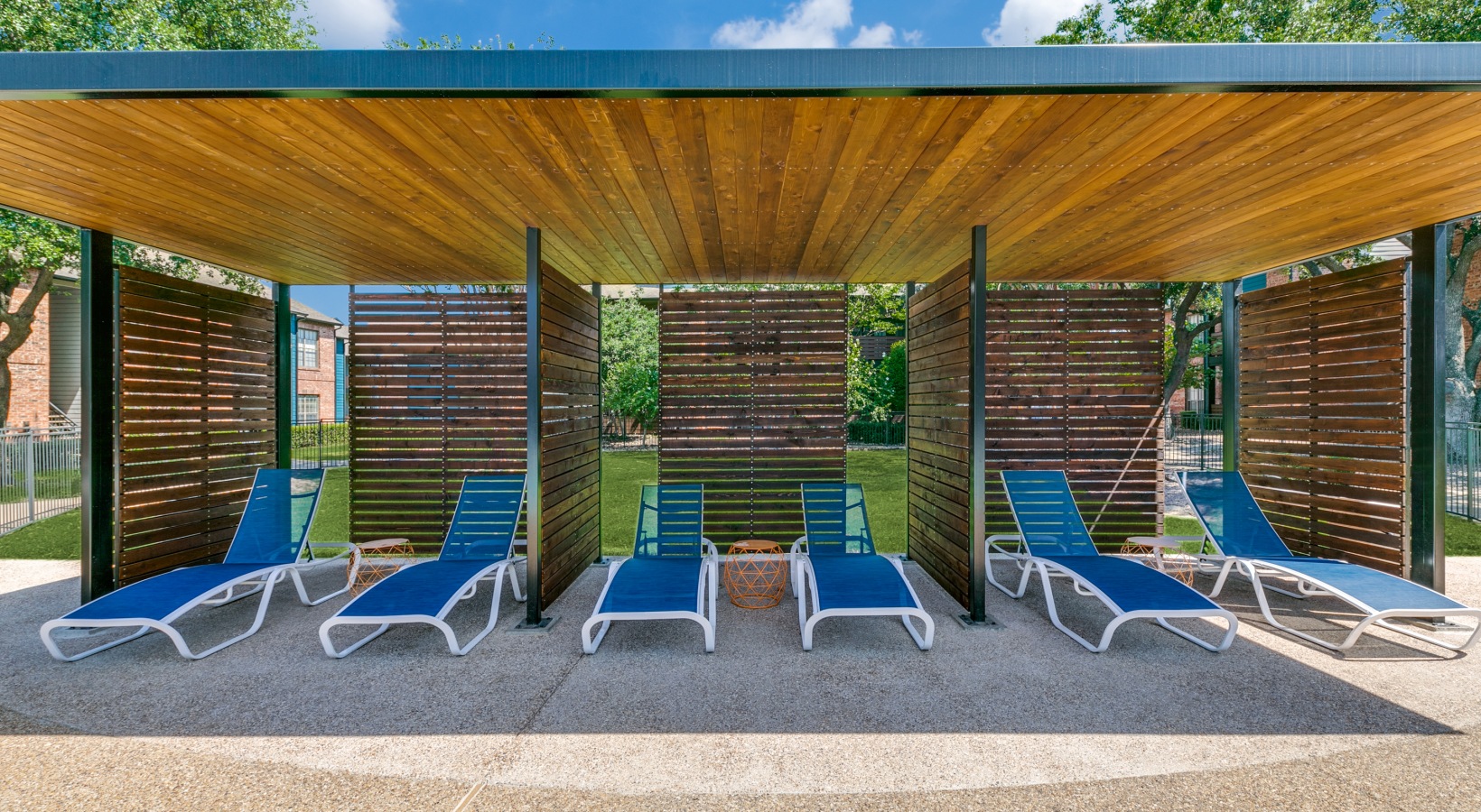 lounge chairs under a covered pavilion at a park at The  Dayton